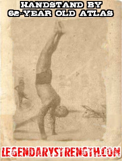 Charles Atlas doing a handstand at 62