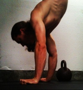 Doing an open fist handstand. Harder than flat hands but easier than fully on the fists.