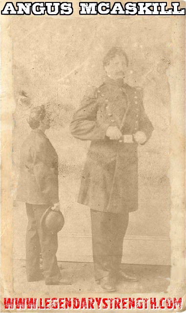 Angus MacAskill standing near averagely tall man