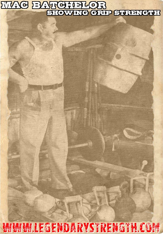 Mac Batchelor holding a barrel with one hand