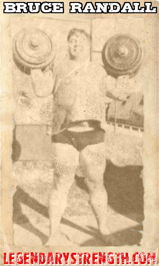 Bruce Randall with a pair of heavy dumbbells