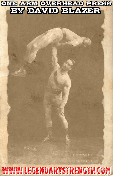 David Blazer pressing his partner overhead using one arm, during one of their performances as The Cornelius Brothers. 